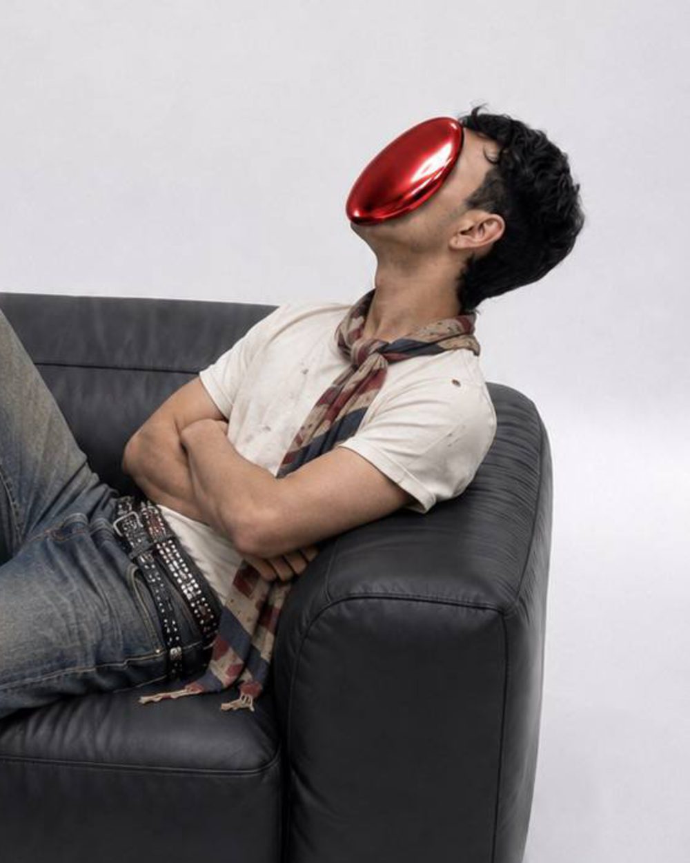 Joseph wearing his red oval mask